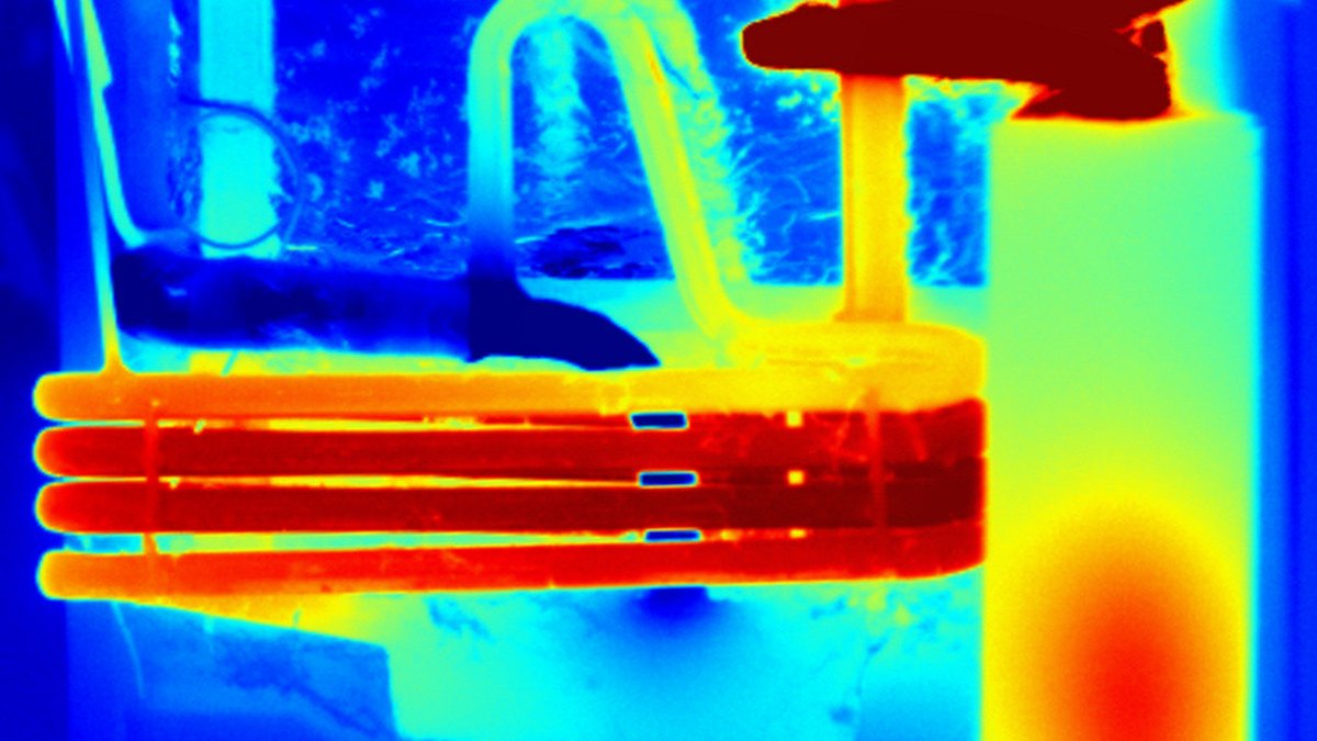 A thermal infrared image showing hot regions in amber-red and cold regions in blue — the visual language of the two Cryoflare temperature-spike landmarks, a Panacea Bio Chem concept by Bogdan Dicoias